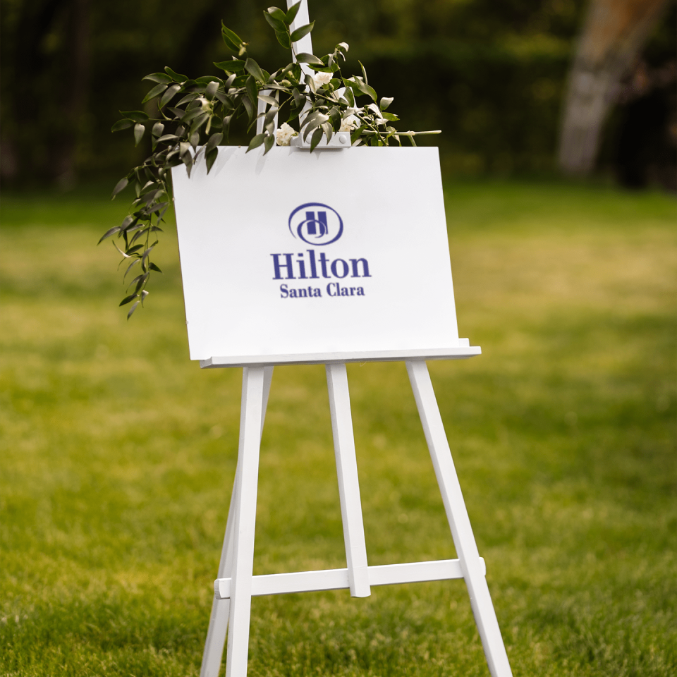 wedding sign mockup featuring white flowers and some petals m28473 r el2
